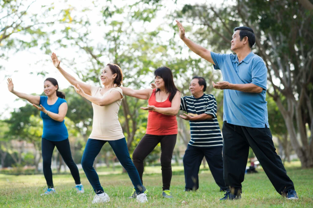 Elderly people practicing Tai Chi